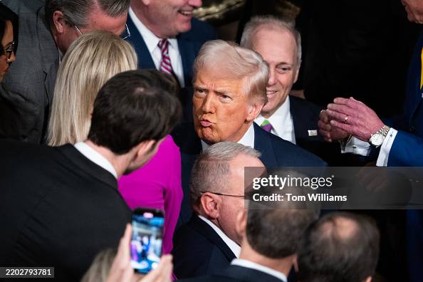 His Addresses President Donald Trump greets members before delivering his address ...