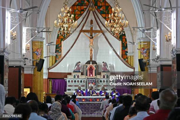 Catholics pray during Ash Wednesday mass at Saint Mary's Basilica in Secunderabad on March 5, 2025.