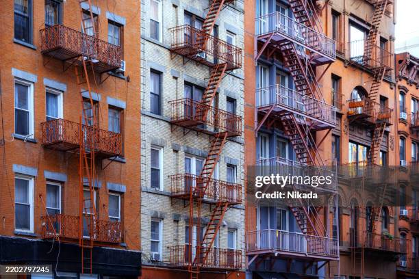 historic buildings with fire escapes in manhattan's soho district - soho new york stock pictures, royalty-free photos & images