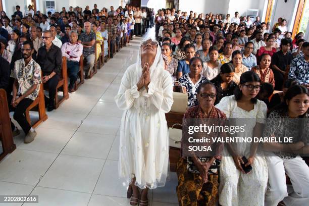 Catholics attend a prayer on Ash Wednesday, which marks the beginning of a 40-day period of Lent that culminates in Easter Sunday, at Balide Church...