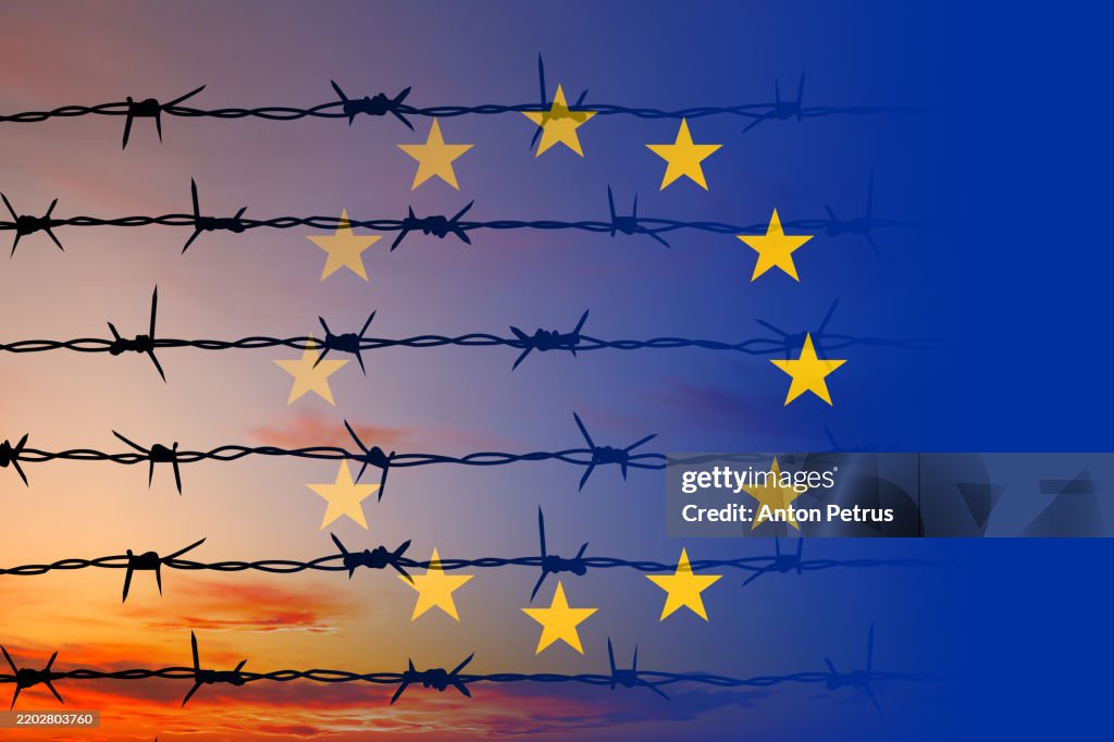 Barbed wire against the EU flag background