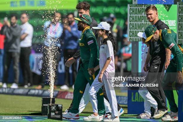 South Africa's and New Zealand's players arrive for national anthems before the start of the ICC Champions Trophy one-day international semi-final...