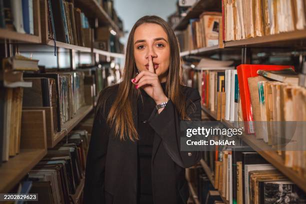 Library Shushing Sign 80 Shushing With Finger Over Lips Stock Photos, High-Res Pictures, and ...
