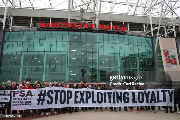 General view outside the stadium as fans of Manchester United display a banner reading '#STOP EXPLOITING LOYALTY' during a protest against ticket...