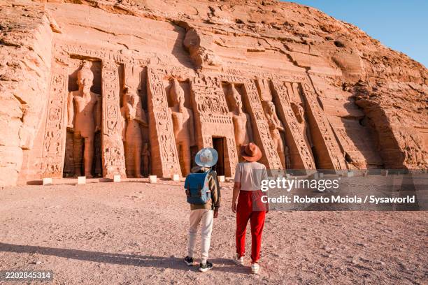 mother and son admiring the temple of nefertari - pharaoh stock pictures, royalty-free photos & images