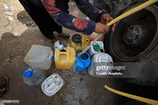 Palestinians, who go through a water crisis due to Israel's blocking of fuel from the Kerem Abu Salim border crossing, which has disrupted the supply...