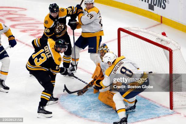Boston Bruins C Charlie Coyle scores against Nashville Predators goaltender Juuse Saros in the first period at TD Garden.