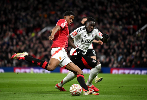 Chido Obi-Martin of Manchester United shoots on goal whilst under pressure from Calvin Bassey of Fulham during the Emirates FA Cup Fifth Round match...