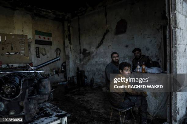 Child labor is having lunch at work with greasy hands along with his coworkers in Douma, Sryia on February 6, 2025.