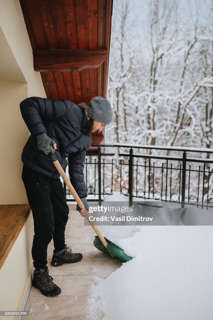 Man with snow shovel