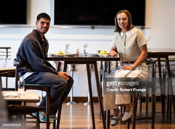Iga Swiatek of Poland and Carlos Alcaraz of Spain attend the champions lunch on Day 1 of the BNP Paribas Open at Indian Wells Tennis Garden on March...