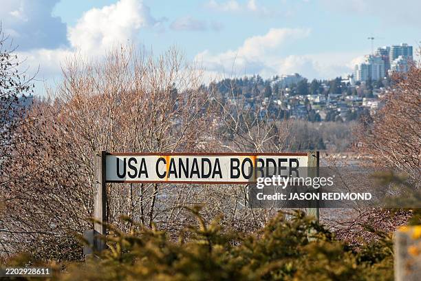Sign for the US-Canada border is pictured at the Peace Arch border crossing in Blaine, Washington, on March 5, 2025. The United States will allow a...