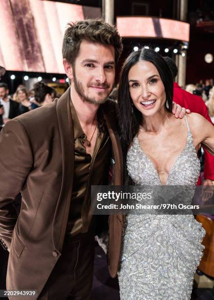 Andrew Garfield and Demi Moore attend the 97th Annual Oscars at Dolby Theatre on March 02, 2025 in Hollywood, California.