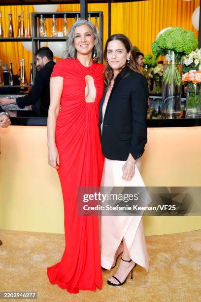 Radhika Jones, Editor-in-Chief of Vanity Fair and Amanda Peet attend the 2025 Vanity Fair Oscar Party Hosted By Radhika Jones at Wallis Annenberg...