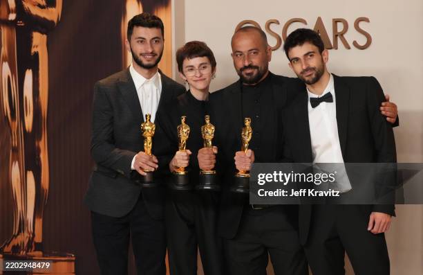 Basel Adra, Rachel Szor, Hamdan Ballal, Yuval Abraham, winners of the Best Documentary Feature Film for “No Other Land”, pose in the press room...