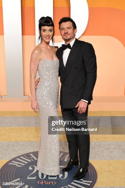 Katy Perry and Orlando Bloom attend the 2025 Vanity Fair Oscar Party Hosted By Radhika Jones at Wallis Annenberg Center for the Performing Arts on...