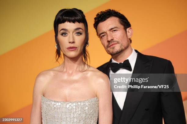 Katy Perry and Orlando Bloom attend the 2025 Vanity Fair Oscar Party Hosted By Radhika Jones at Wallis Annenberg Center for the Performing Arts on...