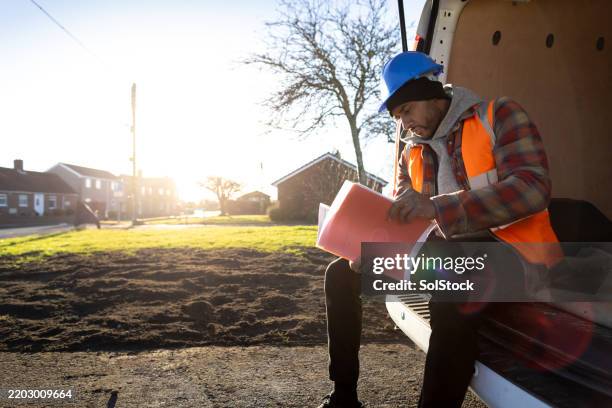 reading street maintenance plans - builders boots stock pictures, royalty-free photos & images