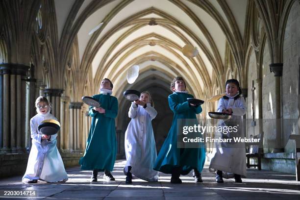 Probationer Choristers of the Salisbury Cathedral Choir practice tossing pancakes ahead of Shrove Tuesday, at Salisbury Cathedral, on March 03, 2025...