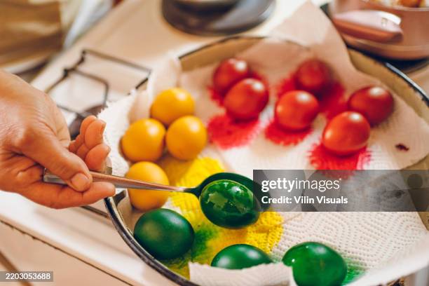 woman decorating easter egg - one woman cooking drawing stock pictures, royalty-free photos & images
