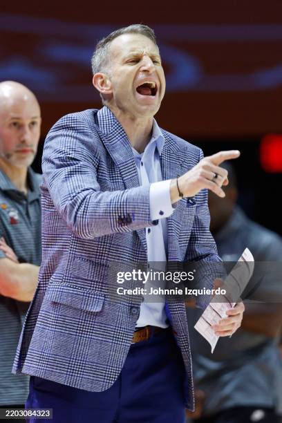 Head Coach Nate Oats of the Alabama Crimson Tide reacts to a play during the first half at Thompson-Boling Arena on March 01, 2025 in Knoxville,...