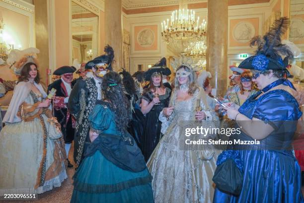 Guests watch the Minuetto masquerade in the halls of La Fenice theatre during the 2025 Carnival celebrations, the event is organised by Atelier...