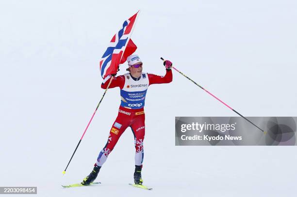 Johannes Hoesflot Klaebo of Norway approaches the finish line to win the men's 4x7.5-kilometer cross-country team relay at the Nordic World Ski...
