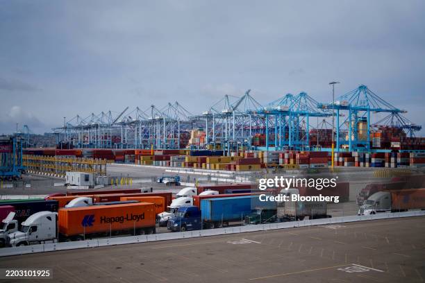 Trucks carrying shipping containers at the Port of Los Angeles in Los Angeles, California, US, on Thursday, March 6, 2025. US President Donald Trump...