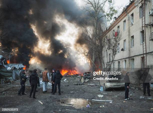Emergency teams and civilians are at the scene where a Russian Iskander missile hit a civilian infrastructure facility, causing an explosion and...