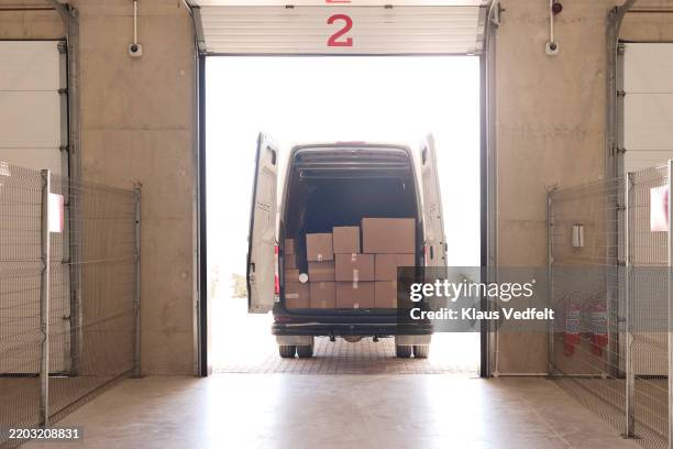 cardboard boxes loaded in delivery van - delivery truck stock pictures, royalty-free photos & images