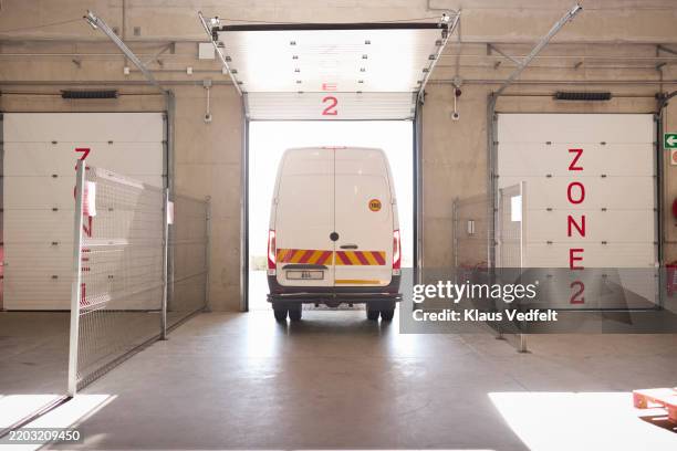 delivery van at loading dock - dock door stock pictures, royalty-free photos & images