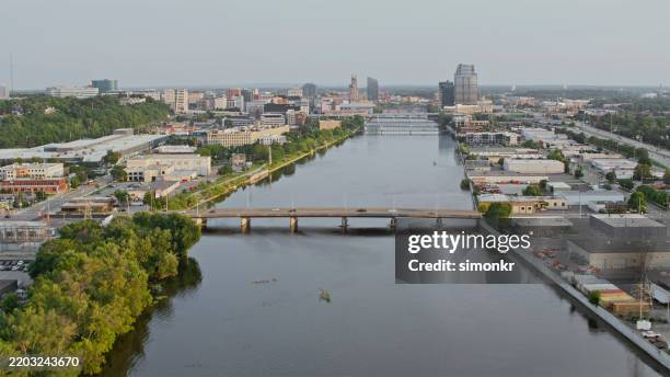 grand rapids scenic river view with urban skyline - grand rapids michigan stock pictures, royalty-free photos & images