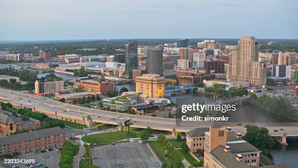 panoramic view of grand rapids downtown skyline at dusk - grand rapids minnesota stock pictures, royalty-free photos & images