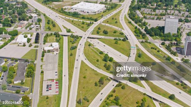 efficient highway stack interchange in sunny lansing michigan - midwest usa stock pictures, royalty-free photos & images