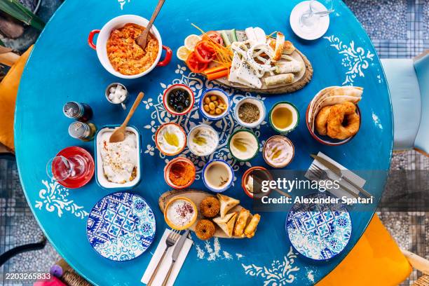traditional turkish breakfast with various meze dishes and cheese board served in a restaurant, high angle view - cucina del medio oriente foto e immagini stock