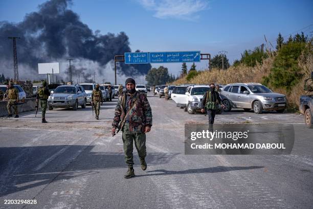 Battles take place between the new Syrian government's Defense Ministry forces and the forces loyal to Bashar Assad on March 7 in outskirts of...