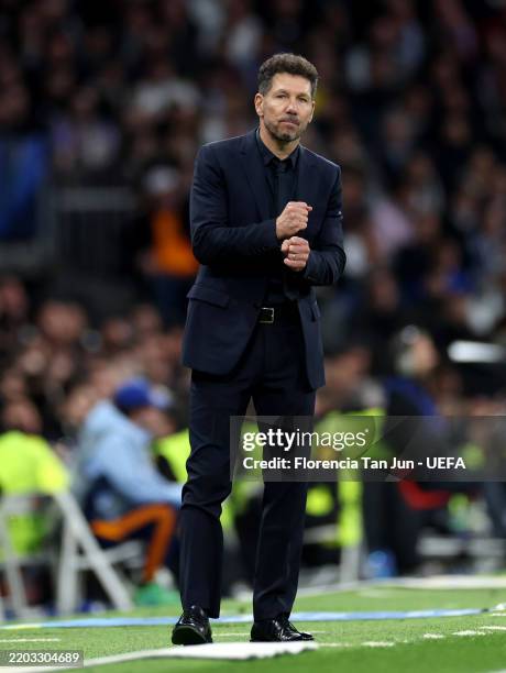 Diego Simeone, Head Coach of Atletico de Madrid, looks on during the UEFA Champions League 2024/25 Round of 16 first leg match between Real Madrid...
