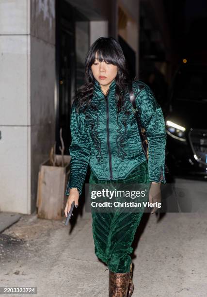Susie Lau wears green zipper jacket, velvet skirt outside Alaia during the Womenswear Fall/Winter 2025/2026 as part of Paris Fashion Week on March...