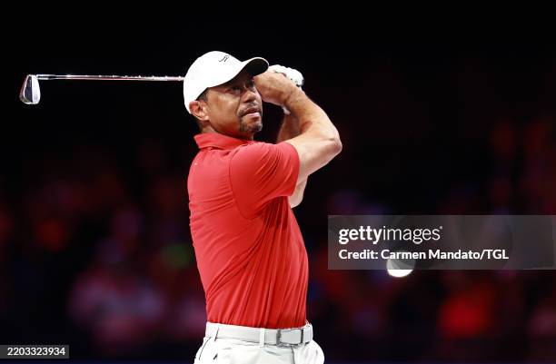 Tiger Woods of Jupiter Links Golf Club plays a shot on the first hole during their TGL presented by SoFi match against the Atlanta Drive GC at SoFi...