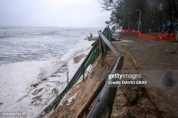 Waves break onto the sand foundations of the footpath along Main Beach located on the Gold Coast on March 8, 2025. Cyclone Alfred weakened into a...