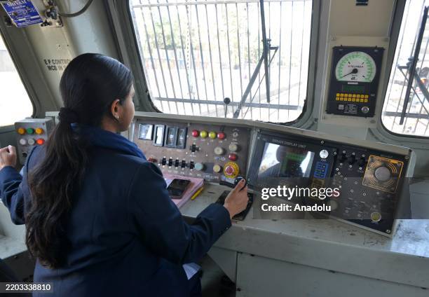 Years old Indian woman Uma is seen on the driving seat of a railway engine compartment to drive a cargo/goods train at New Delhi railway station in...