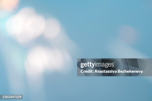 Background with bright colored highlights of light on a blue background Background with bright colored highlights of light on a blue background