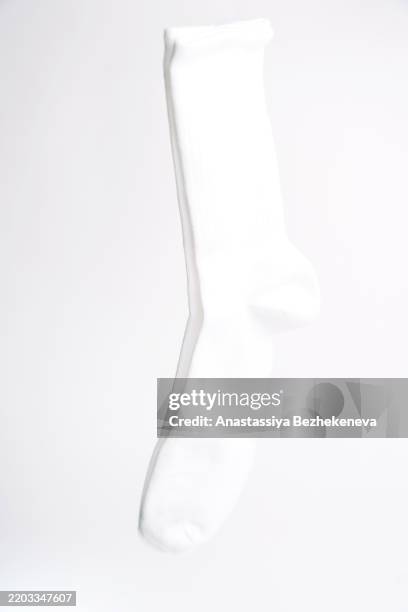 white socks on a white background - socks isolated stock pictures, royalty-free photos & images