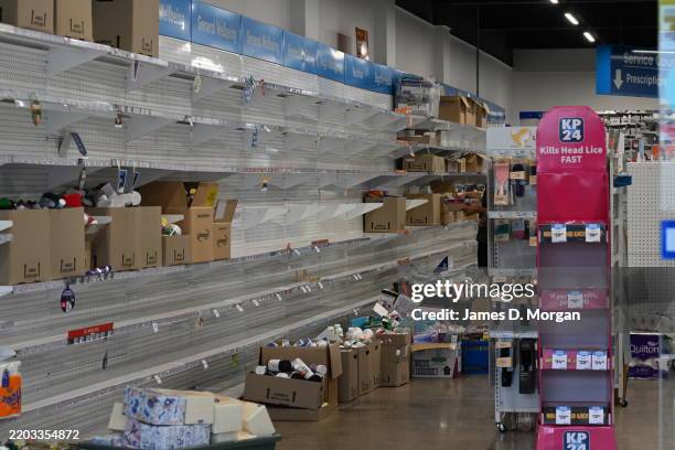 Stock is removed from a business on March 05, 2025 in Lismore, Australia. Tropical Cyclone Alfred is expected to make landfall in southeast...