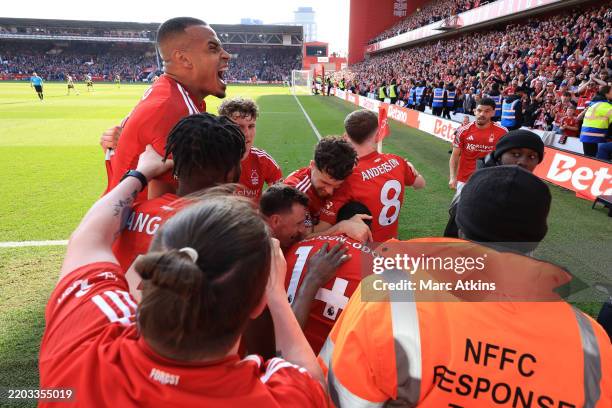 Callum Hudson-Odoi of Nottingham Forest celebrates scoring the first goal with team mates during the Premier League match between Nottingham Forest...
