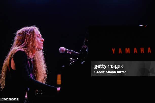 Apple Singer American singer-songwriter Fiona Apple performing on stage, 1997. News ...