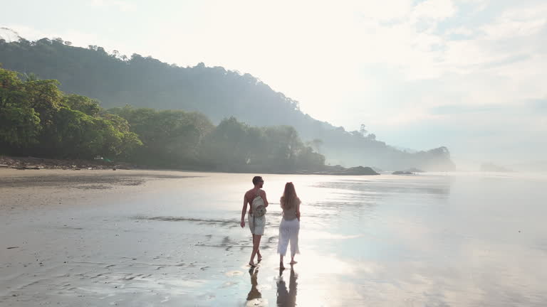https://media.gettyimages.com/id/2203432366/video/couple-walking-hand-in-hand-on-serene-beach-costa-rica.jpg?b=1&s=640x640&k=20&c=mA-5gXnLXzKKK6H0q7dyYlh7iwRJt_Z1fSgLVMbg8Cs=