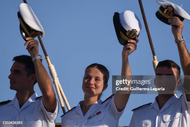 Crown Princess Leonor of Spain and other training companions of the Spanish Navy wave after arriving at Montevideo Port on March 05, 2025 in...