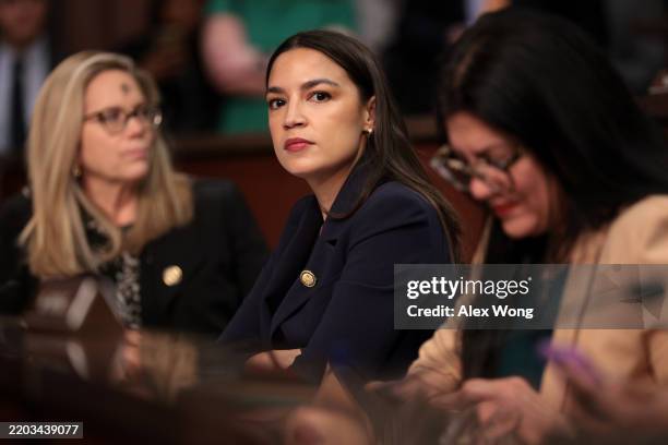 Rep. Alexandria Ocasio-Cortez looks on during a House Oversight and Government Reform Committee hearing on sanctuary cities' policies at the U.S....
