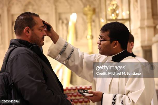 People receive ashes on the forehead on Ash Wednesday at St. Patrick's Cathedral on March 05, 2025 in New York City. Ash Wednesday is the start of...